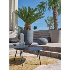 Outdoor patio seating area with landscaping