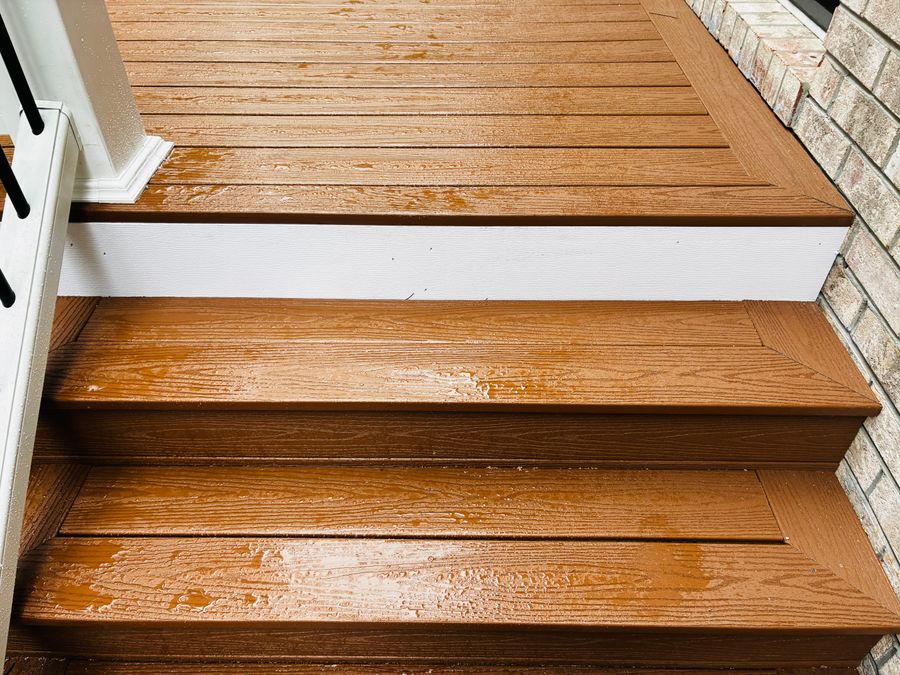 Stained wooden steps with white risers