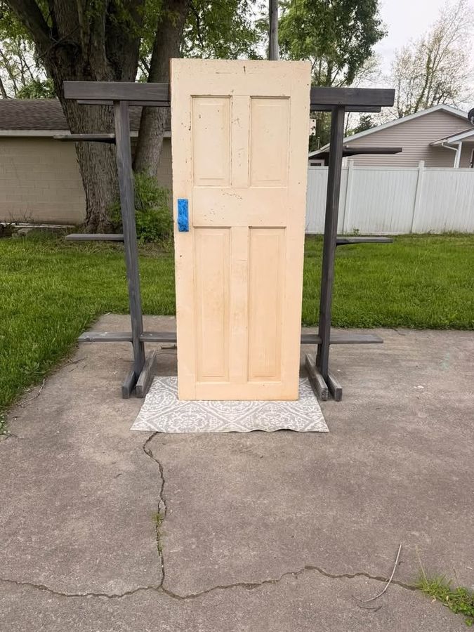 Four panel door primed and finished on sawhorses outside the shop in La Porte County, Indiana