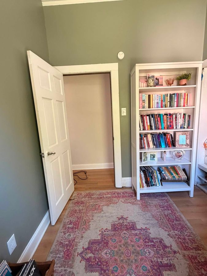 Interior door open against repainted sage walls and white casing in a La Porte County, Indiana home