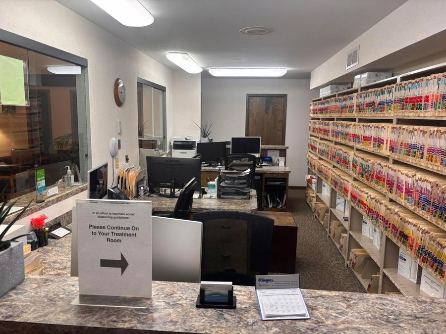 Clean office front desk and filing shelves cleaned by Busy B's
