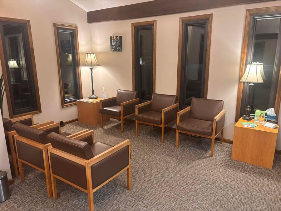Office waiting room with a row of clean chairs