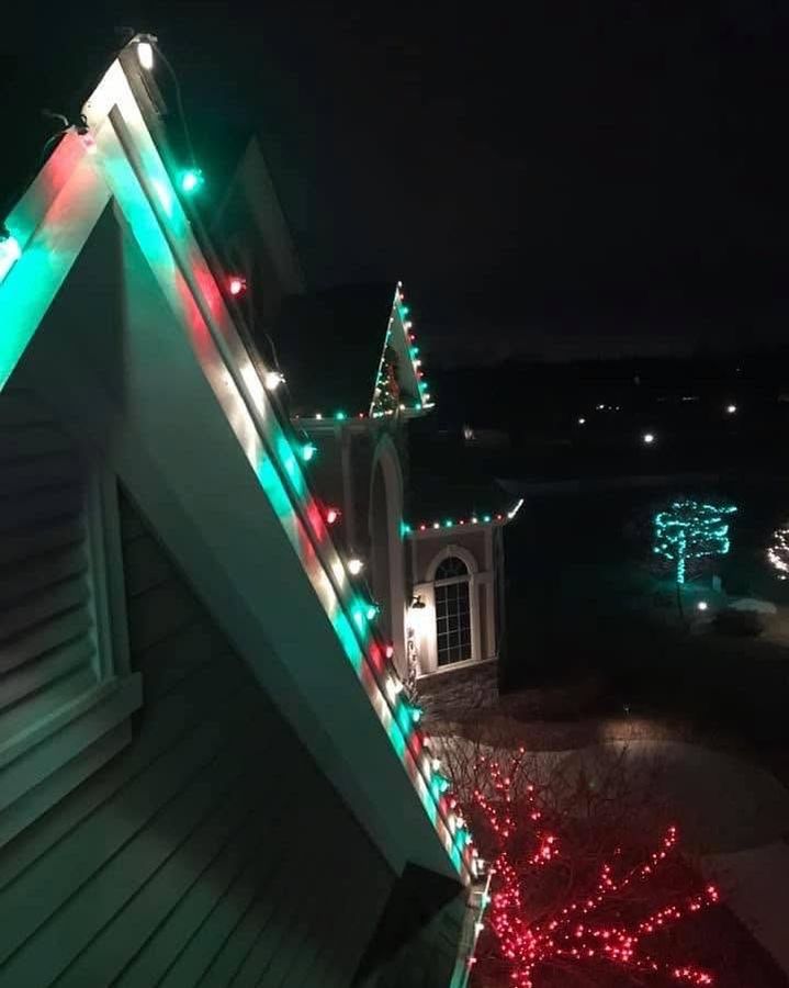 Close view of green and red lights along a gable