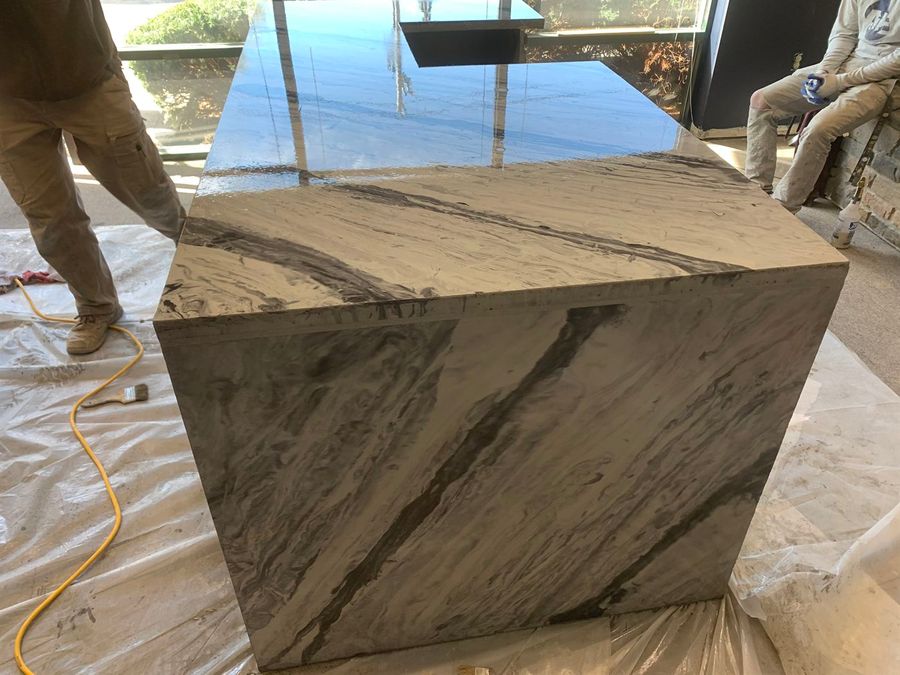 Marble-look countertop island being finished