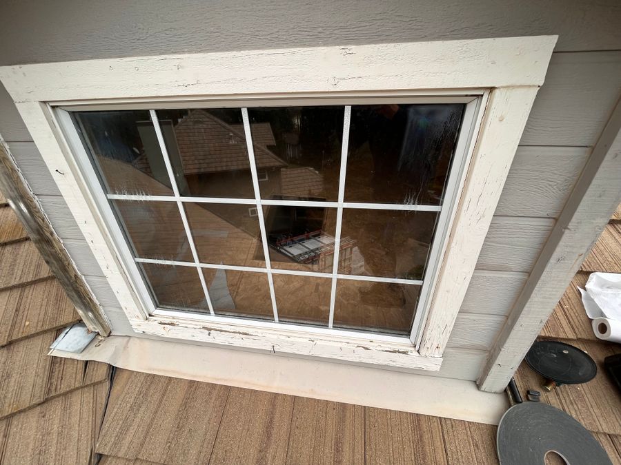 Window with damaged grids, photographed before repair