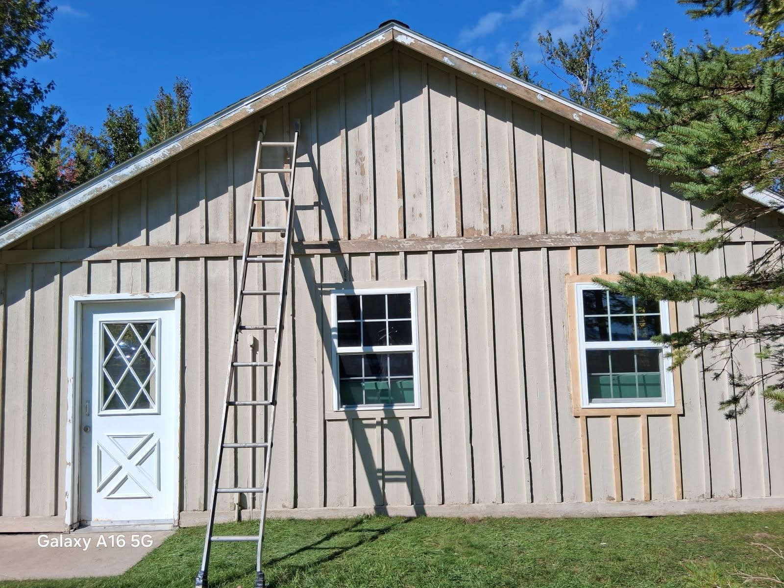  for Deluxe New World Painting Company  in Cheboygan, MI